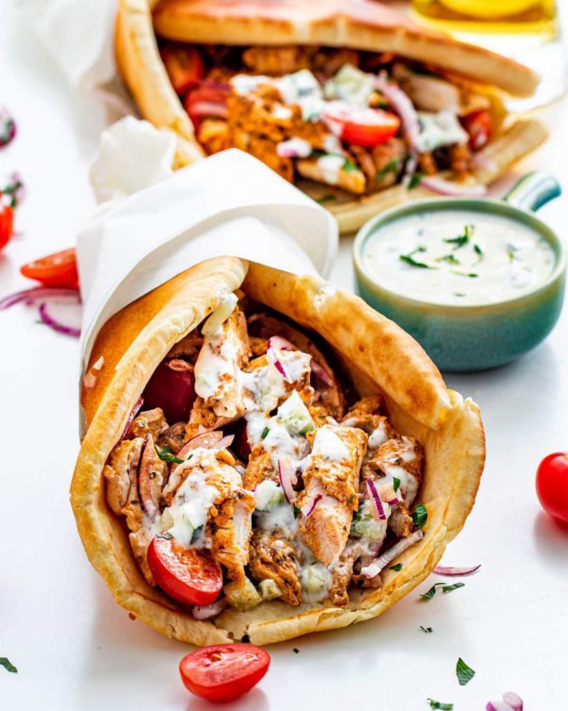 Chicken gyro  · Pita, halal chicken , lettuce, tomates ,cucumber, white & hot sauce 