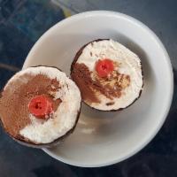 Tartufo Ice Cream · Chocolate covered vanilla and chocolate ice cream with a cherry center.