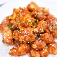 Orange Chicken · Golden fried white meat chicken wok tossed in orange peeled spicy sauce. Choice of fried or ...