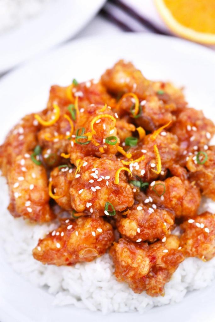Orange Chicken · Golden fried white meat chicken wok tossed in orange peeled spicy sauce. Choice of fried or white rice. Spicy.