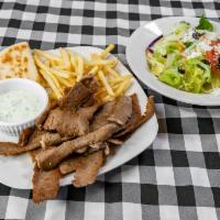 Gyros Dinner · A plate of gyros meat served with warm pita bread, and french fries.