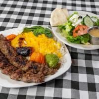 Kubideh Kabob · 2 charbroiled skewers of seasoned fresh ground beef served with basmati saffron rice with gr...