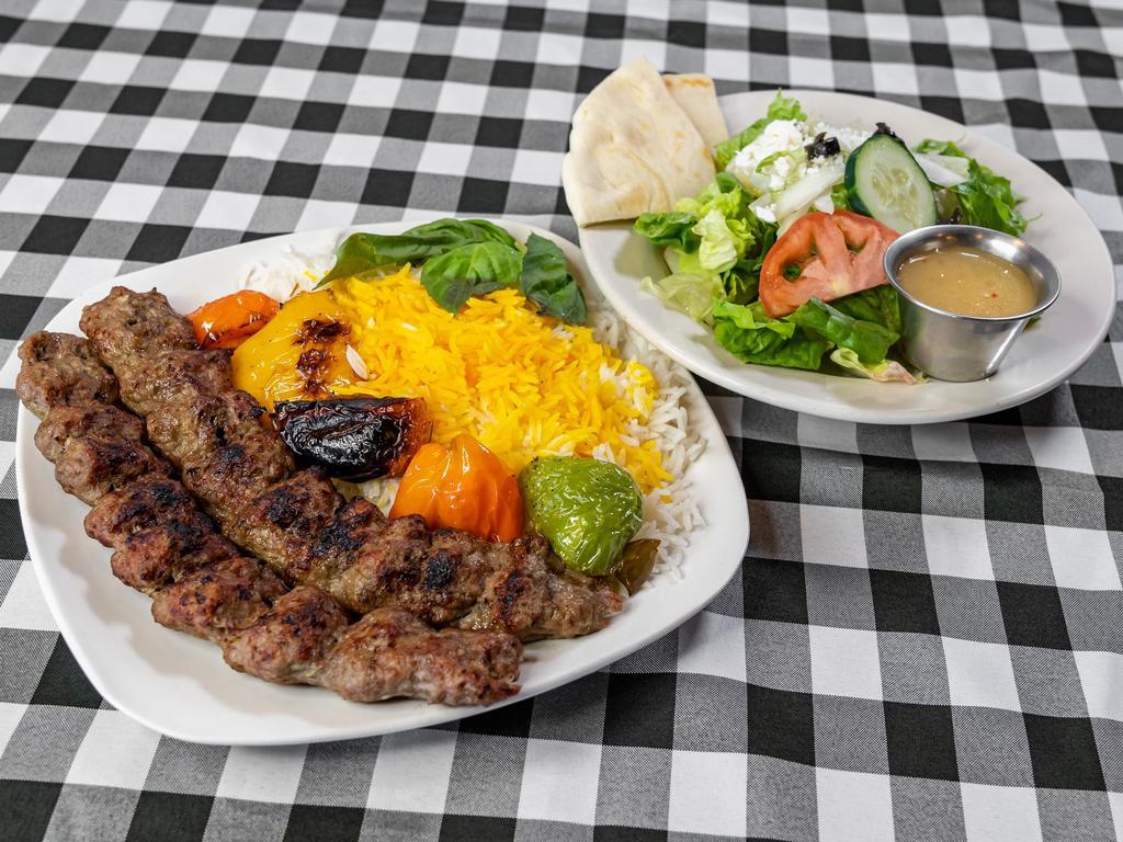 Kubideh Kabob · 2 charbroiled skewers of seasoned fresh ground beef served with basmati saffron rice with grilled vegetable and pita bread.