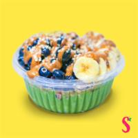 Green Crush Green Bowl · Topped with granola, banana, blueberry, almond, butter, hemp, and honey. Vegetarian-friendly.