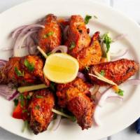 Chicken Wings  · Ginger-Garlic Marinated wings grilled in charcoaled oven (tandoor)
