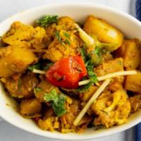 Aloo Gobi  · Cauliflower, potatoes, masala spices, ginger juliennes, fresh tomatoes