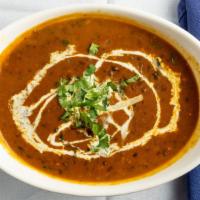 Dal Makhani  · Simmered black lentils, kidney beans, garam masala, ghee
