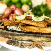 Fish Tandoori Special · Gluten-free. Pakistani-style fish marinated in coriander, all-spice, and red chili flakes. T...