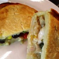 Hatch Green Chili & Chicken Pie · Chicken breast marinated in Hatch green chile blend, corn, black beans, potatoes, Poblano pe...