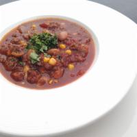 Beef and Bean Chili Bowl · Ground beef, corn, pinto beans, garlic, onion, green and red pepper, tomato, green chili.