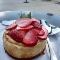 Classic Cheesecake · Cheesecake on graham cracker crust with Market fresh strawberries.