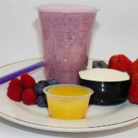 Berry Day Protein Shake · Strawberries, blueberries, raspberries, & pineapple juice topped with a flavor of whey prote...