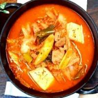 김찌찌개 (Spicy Kimchi Stew with Pork) · Spicy. pork belly in, rice and side dishes are followed