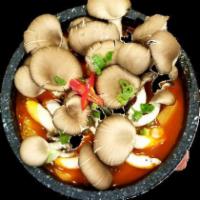 고추장 버섯 째개 (Spicy Mushroom Stew) · Pork in, rice and side dishes are followed