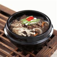 불고기 볶음 (Bulkoki / Stir-fried beef with scallion & mushroom) · Come with rice & side dishes