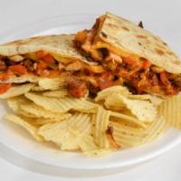 70. Chicken Fajita Panini · Moist grilled chicken, sauteed onions, pepper salsa and melted cheddar cheese.
