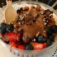Acai Berry Bowl · Blended organic acai berry fruit puree, banana, fresh granola, nuts, coconut flakes, fresh f...
