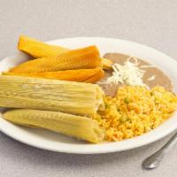 Tamale Plate · 4 chicken, cheese or pork tamale. Served with rice, salad, beans
