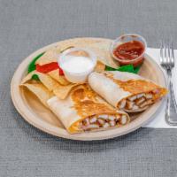 Crispy Chicken Quesadilla · Filled with pico de gallo and melted mixed cheese. Served with salsa and sour cream.