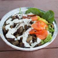 Lamb Beef Gyro Rice Bowl · Served on a bed basmati rice with spring mix, our signature tzatziki and spicy sauce.