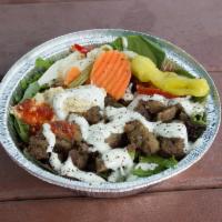 Lamb Beef Gyro Salad Bowl · Served on a bed of spring mix with hummus, our signature tzatziki and spicy sauce.