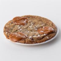 Sea Salt Caramel Cookie to go · A thick chocolate chunk cookie topped with homemade caramel candy and sea salt.