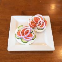 Garden Bagel · Your choice of a plain or everything bagel with cream cheese, red onion, and cucumber.