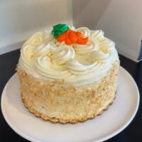 Carrot Cake · A traditional carrot cake, with a creamy cream cheese filling, and icing garnished with Napo...