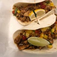 3 Jerk Chicken Tacos · Special blend of jerk spices, marinated boneless chicken breast, mango salsa, lime juice and...