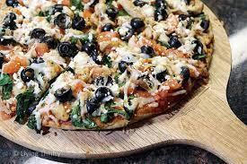 Mediterranean Pizza · Tzatziki sauce, mozzarella, provolone, cheddar cheese, feta cheese, spinach, fresh red onions, fresh tomatoes, black olives and gyro meat.