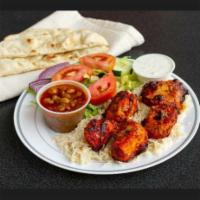 halal boneless chicken kabab  · served with fresh rice , chickpeas,salad,with secret white sauce,marinated and cooked on grill