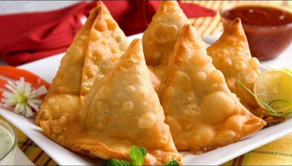 Samosa by piece  · A samosa is a fried or baked pastry with a savoury filling, such as spiced potatoes, onions, peas, or lentils. ...