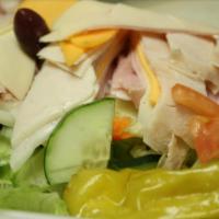 Chef Salad · Romaine lettuce, Roma tomatoes, red onions, cucumbers, green peppers, ham and turkey rolled ...