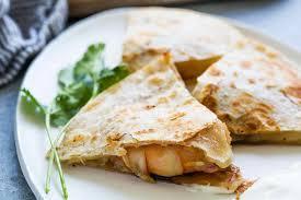 Shrimp Quesadilla · Grilled flour tortilla stuffed with shrimp. Served with a side of fries, sour cream and salsa.
