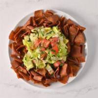 Fattoush Salad · Lettuce, tomatoes, cucumber, red onions, parsley, mint, olive oil, and lemon juice.