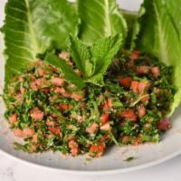 Tabbouleh Salad · Bulgur wheat, parsley, tomatoes, red onion, lemon juice, and olive oil.
