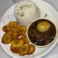 Do Too Much · Green pepper sauce with an assortment of goat meat and boiled egg served with al dente white...