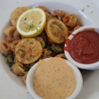 Crispy Fried Calamari · Chili remoulade and cocktail sauce, includes thin sliced lemon, and jalapenos.