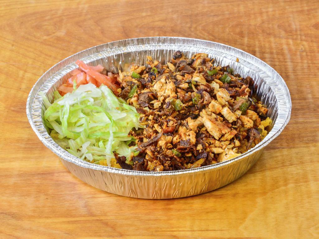 Chicken and Steak Over Rice Bowl · Chicken and steak over rice with grilled onion green pepper and mushrooms with the side of lettuce tomato's topped off
