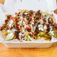 Loaded fries · Chicken or steak with lettuce, tomato, onion, banana peppers, pickles, black olives, jalapeñ...