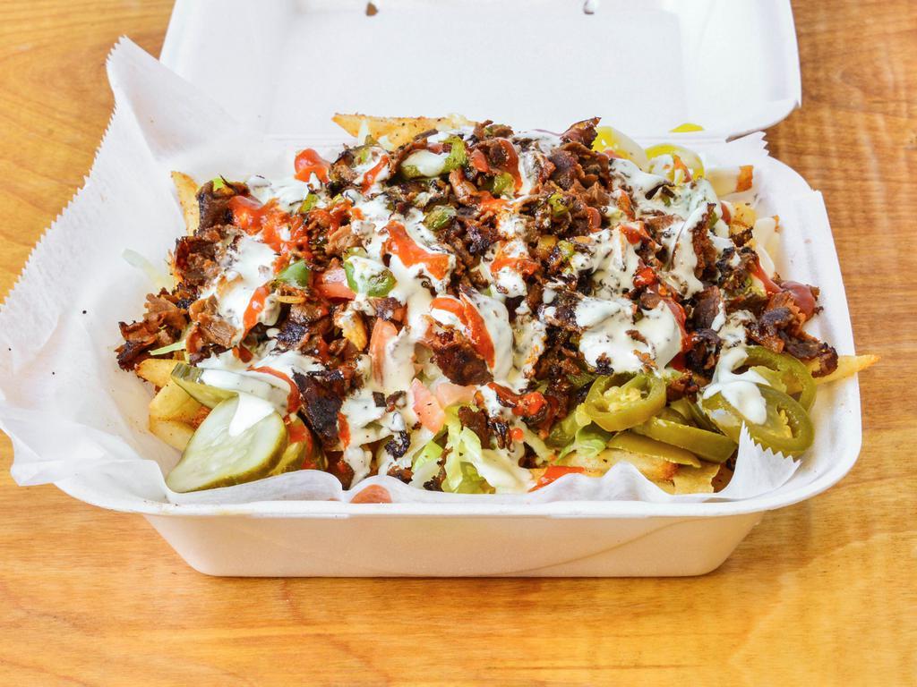 Loaded fries · Chicken or steak with lettuce, tomato, onion, banana peppers, pickles, black olives, jalapeños and our famous white sauce with sriracha 