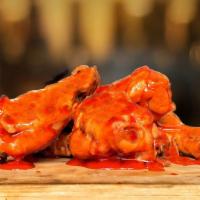Mild Buffalo Wings · Wings tossed with mild Buffalo wings sauce served with your choice of blue cheese or ranch.