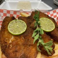 Daily Milanesa · Breaded steak or chicken with 2 sides and a side salad.