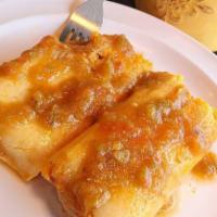 Tamale a la Carte · Corn husk with corn masa and choice of filling and steamed.
