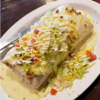 Burrito Supreme · Huge flour tortilla stuffed with ground beef and shredded pork in tomato sauce with rice and...