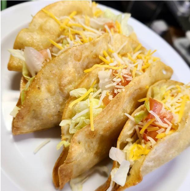 Flour Deep Fried Tacos Plate · 3 flour deep-fried tacos with choice of shredded chicken or ground beef, lettuce, tomatoes & cheese. Served with rice and beans.
