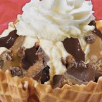 Warm Peanut Butter Cup Sundae · 2 scoops of vanilla ice cream topped with hot fudge and warm peanut butter sauce, chopped Re...