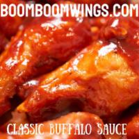 #1. The Classic Wings · Jumbo wings baked then fried crispy, tossed in Classic Buffalo sauce & chunky blue cheese dr...