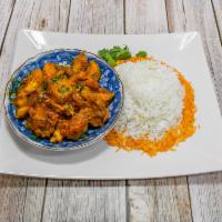 Chicken Curry · Chicken meat sauteed in India’s favorite yellow curry sauce cooked with grilled onions, turm...