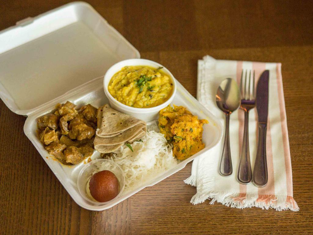 Goat Meat Platter · Comes with rice, chappati, daal, goat curry, pakora and rice pudding or gulab jamun.